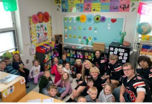 Mrs. McCandlish's Class with Football Players on Reading Day
